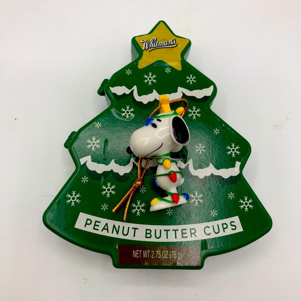 Whitman’s/ 2010 Peanuts Snoopy Christmas ornament. Snoopy has Christmas lights.